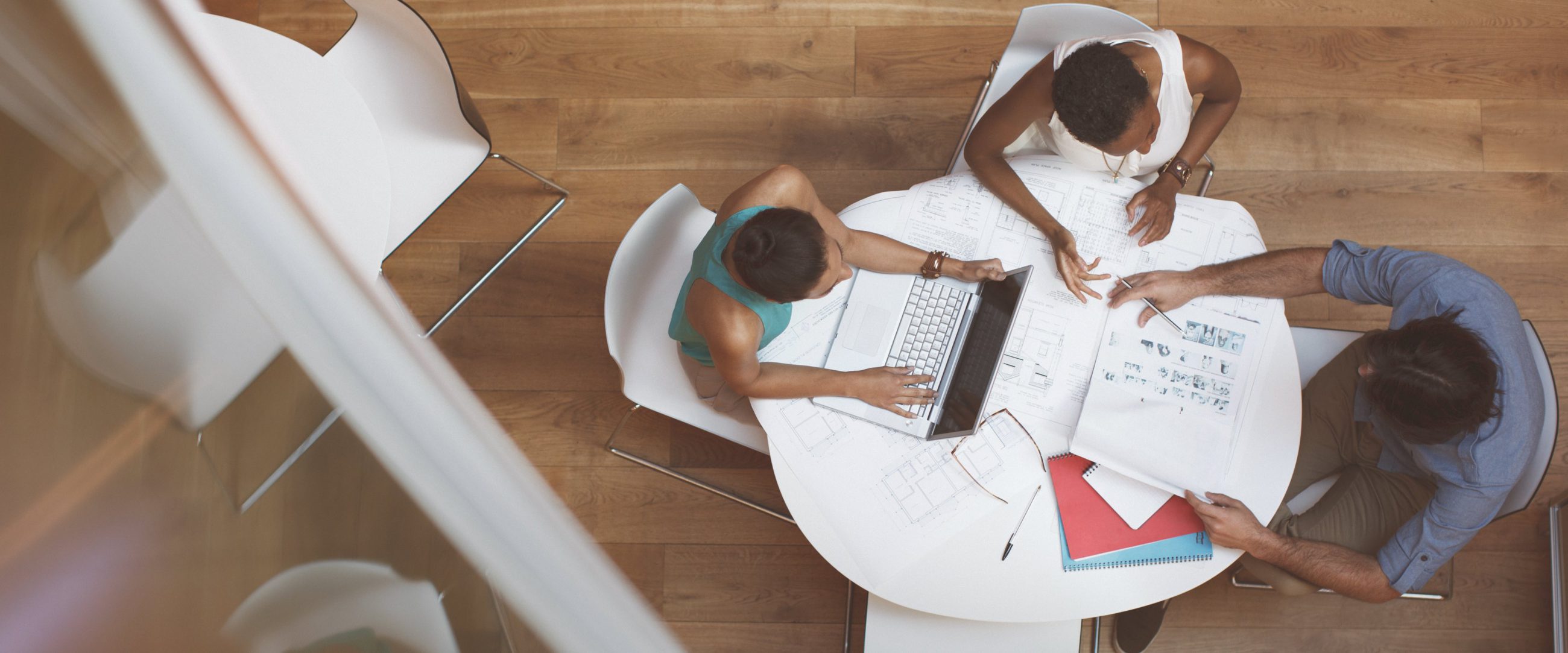 Staff meeting sitting at a table