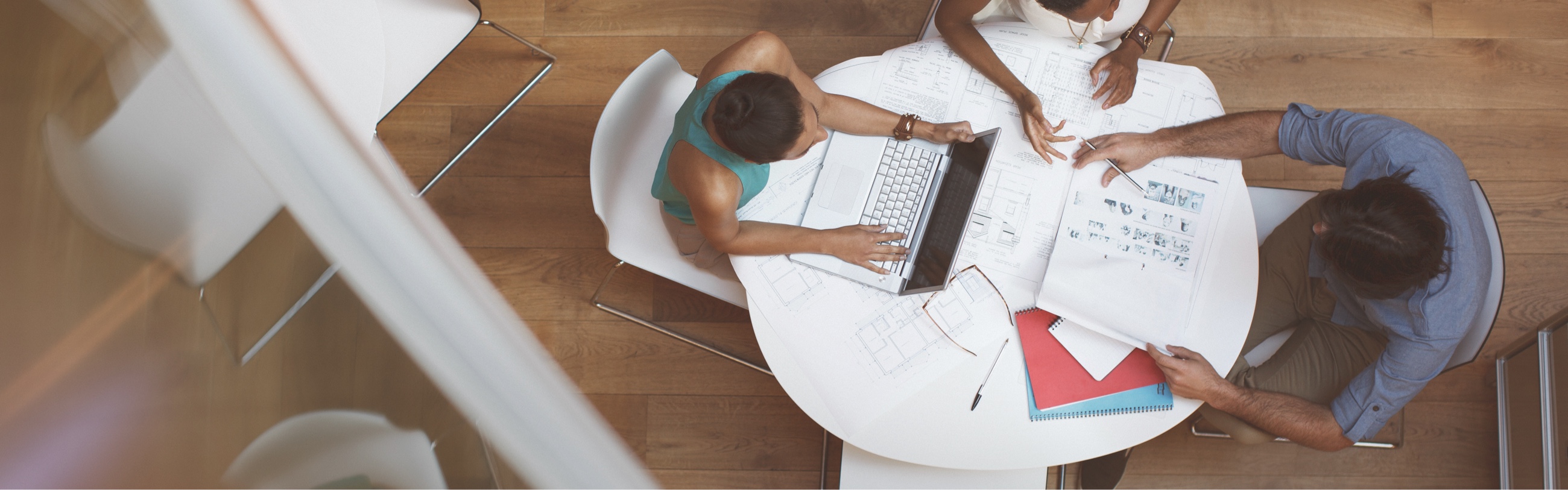Staff meeting sitting at a table