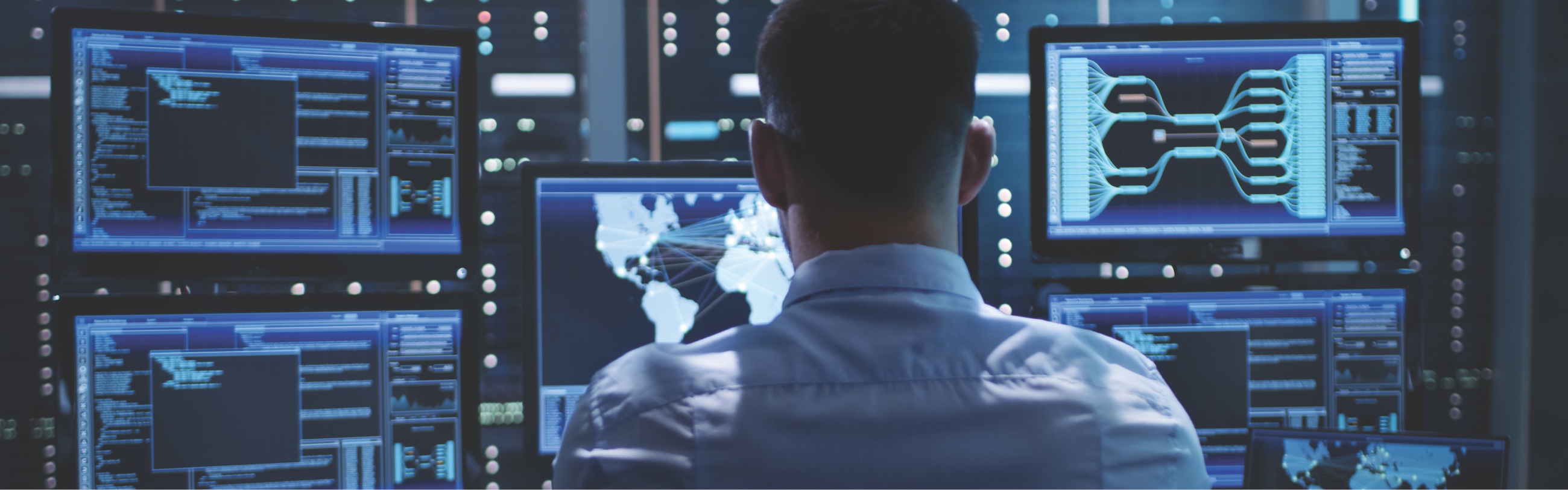 Man at computer looking at global networks and 2021 Technology Trends
