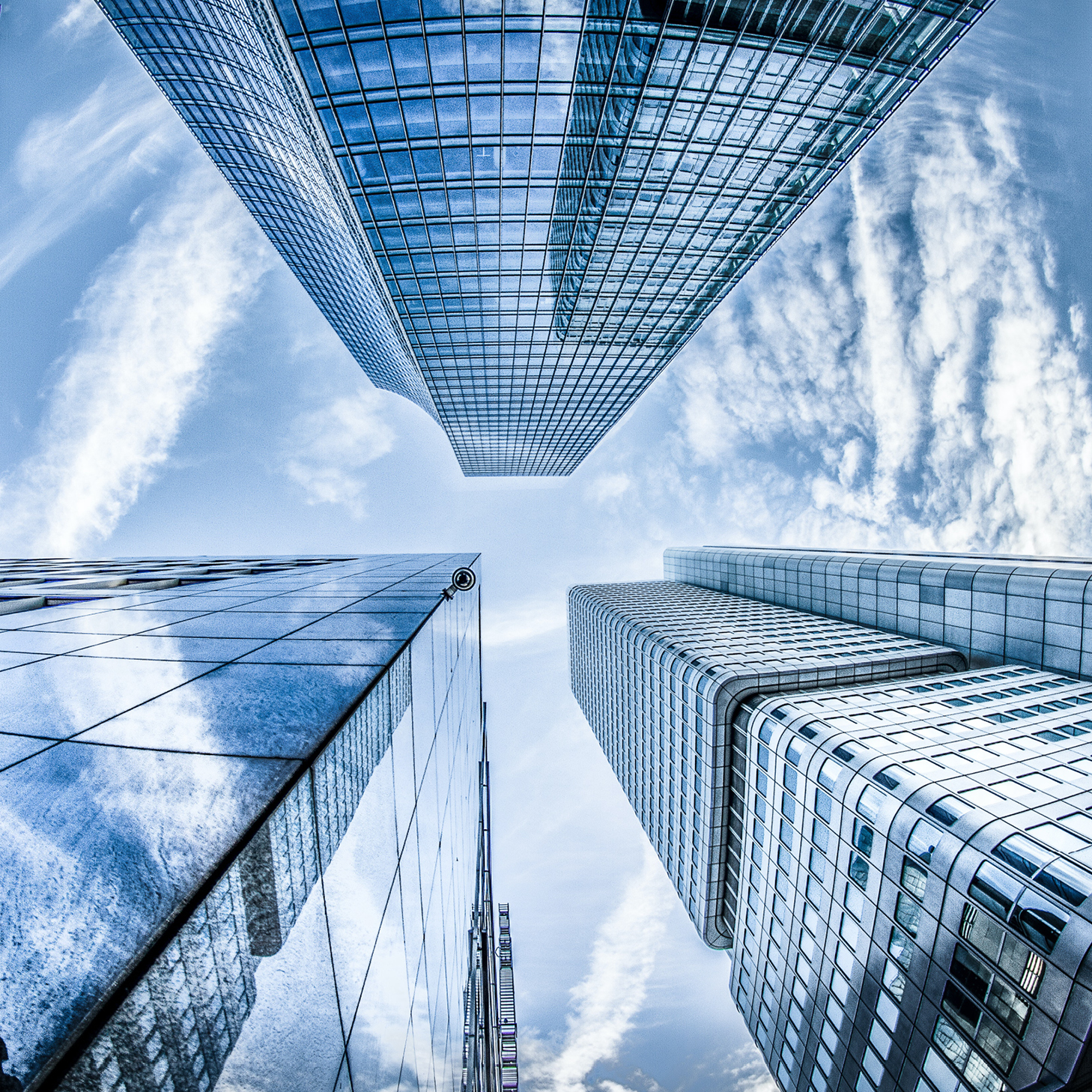 An aerial image looking up at skyscrapers