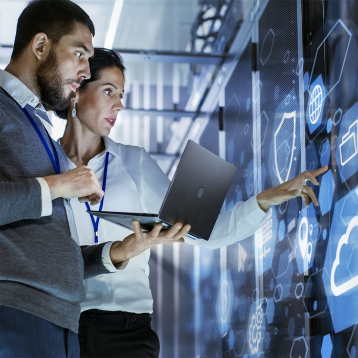 Engineers touching a screen