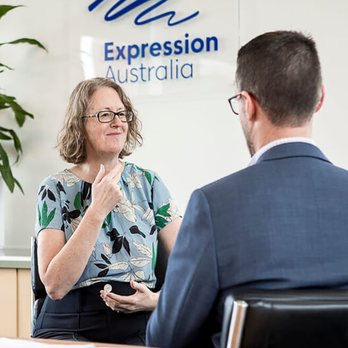 A deaf and mute woman expresses herself through gestures and facial expressions.