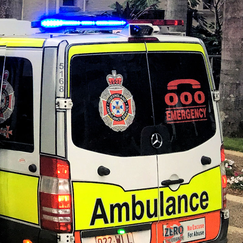 Ambulance car showcasing its contact details, including the 000-emergency number.